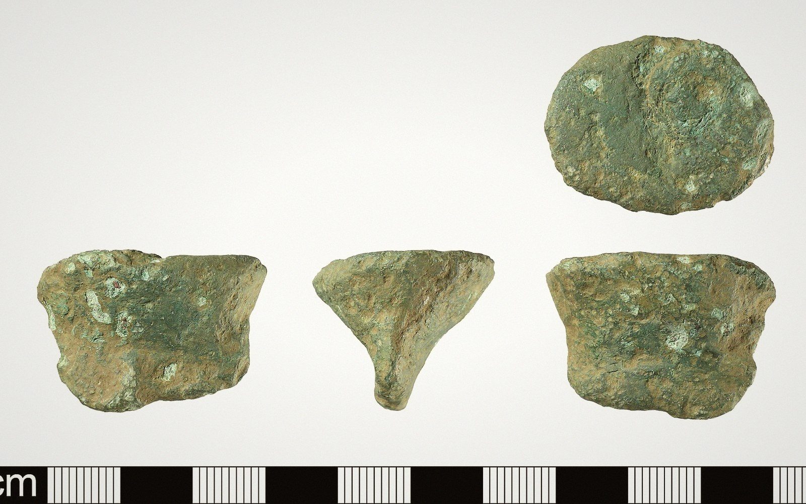 Corroded bronze casting jet fragments shown from four angles beside a metric scale bar