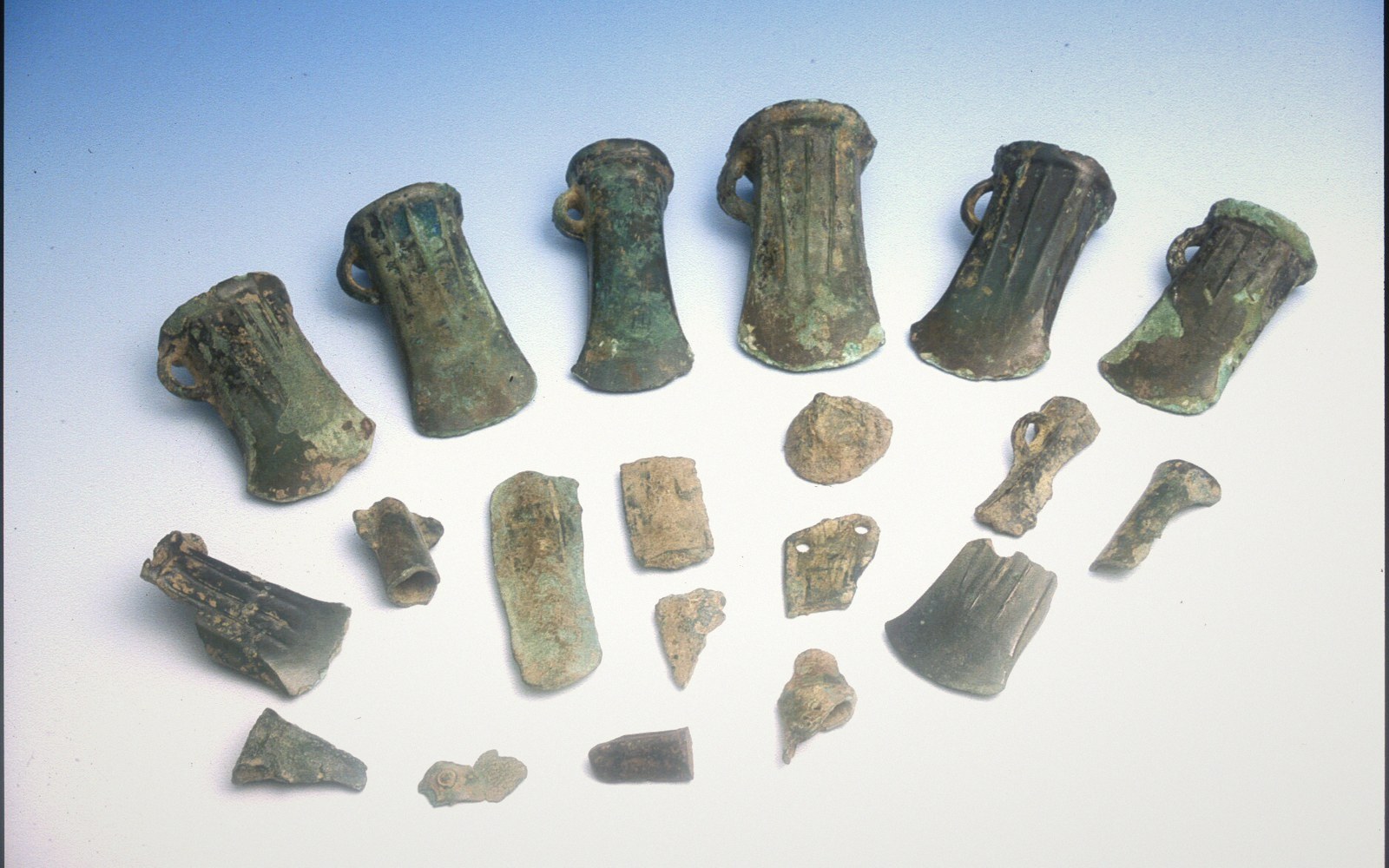 A hoard of broken bronze laid out on a tray